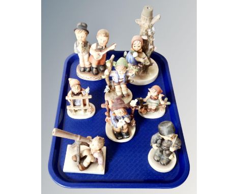A tray of six Goebel figures together with a lamp base and further similar figure (8)