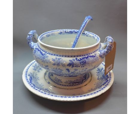 A large blue and white soup tureen on stand, with ladle, base 35cm diameter