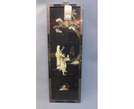 A Chinese lacquered wall hanging panel, decorated with figures beneath tree with floral border. H.91cm W.31cm 