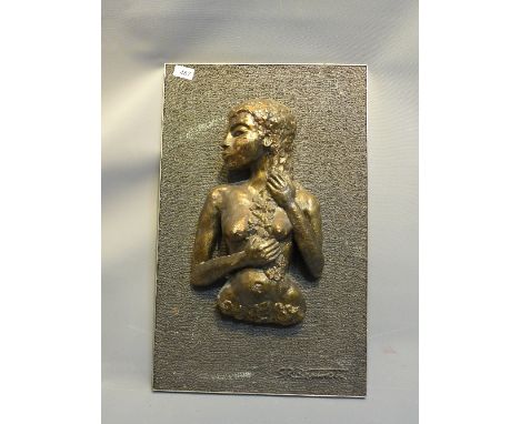 A bronze plaster plaque of a nude female, signed S.R. Bennett