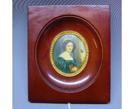 A miniature portrait of a lady deep in thought clutching a bible, in rectangular mahogany frame, 7 x 6cm