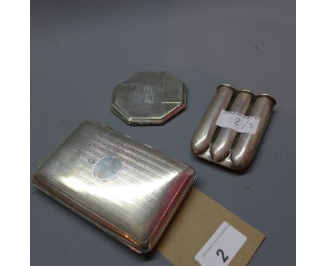 A silver cigarette holder with engine turned design and vacant cartouche, hallmarked Birmingham 1911-12, together with a Vict