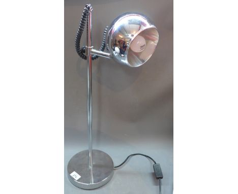 A 1960's adjustable chrome table lamp, raised on circular base, H:69cm