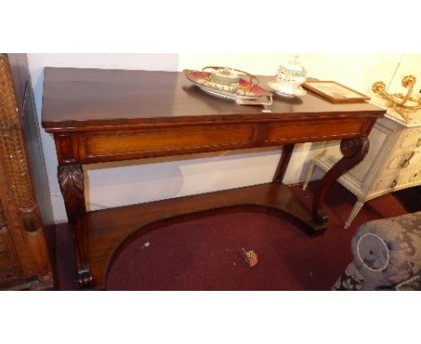 A William IV rosewood console table with two drawers raised on carved sabre legs and plinth base, H. 85cm W. 150cm D. 52cm