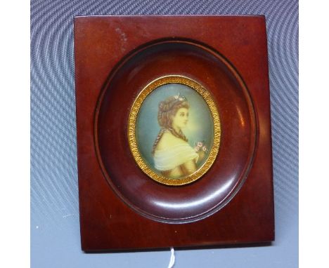 A miniature portrait of a lady holding pink flowers, in a rectangular mahogany frame, 6 x 5cm