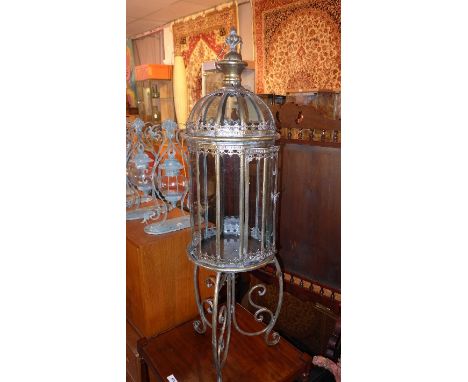 A large gilt metal storm lantern on stand
