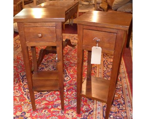 A pair of Contemporary teak lamp tables, with single drawer raised on square legs, H. 84cm W. 32cm D. 31cm
