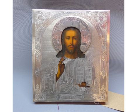 A Russian icon depicting Jesus, with silver oklad over painted wooden panel, Russian hallmarks to base, 27 x 23cm