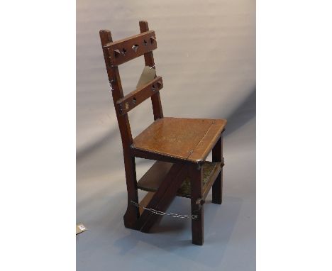 An arts and crafts oak metamorphic step ladder / chair