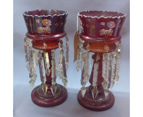 A pair of Victorian ruby glass lustres with floral design and cut glass droplets. H.37cm 