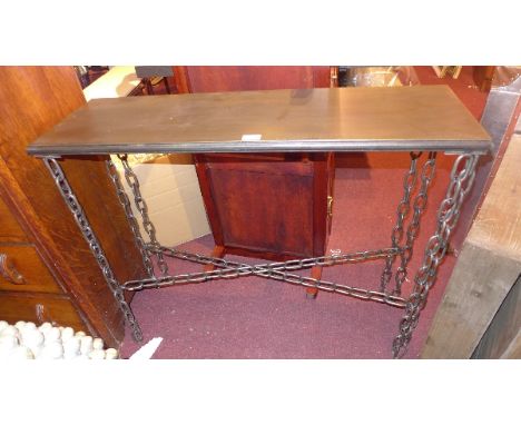 An industrial console table with chain link legs and stretchers, H:83cm W:101cm D:31cm