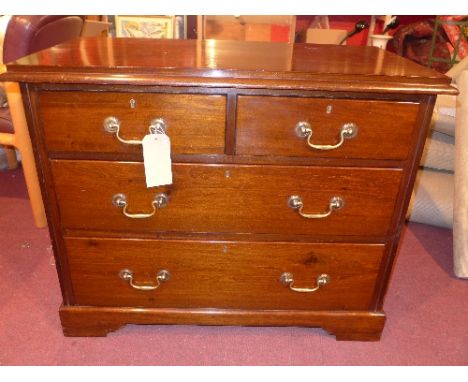 A 20th century mahogany chest of two short over two long drawers, raised on bracket feet, H. 77cm, W. 96cm, D. 49cm