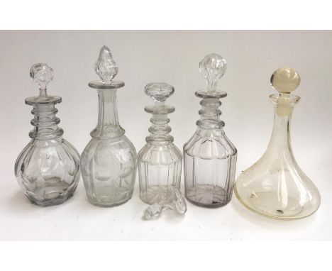 Four Georgian and later cut glass decanters; together with one ships decanter 