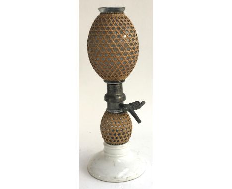 A 19th Century double gourd wicker and glass soda siphon with ceramic base. 43.5cmH 