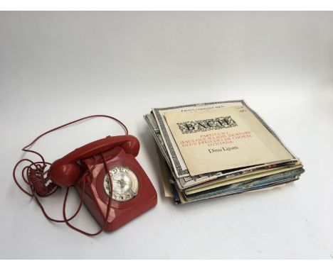 A mixed lot of LPs, mostly classical, together with a vintage red rotary telephone 