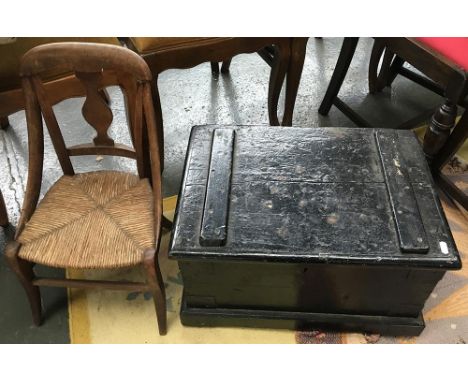 A wooden trunk with loop handles, 55cmW, containing a quantity of books, stained glass panel etc; together with a child's cha