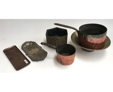 Two Victorian copper saucepans, the smaller 12cmD marked A &amp; N, the other 18cmD marked with a crown over W; together with