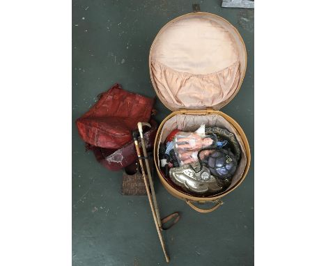 A vintage leather hat box containing an assortment of interesting things: to include glass float, various dolls, inkwell, sev