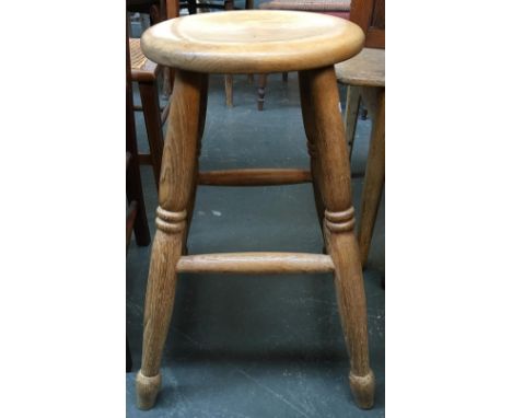 An oak kitchen stool on ring turned legs and turned stretchers 