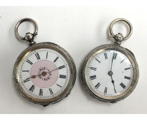 Two Continental silver open faced pocket watches, approximately 4cm and 3.8cm diameter; together with a gent's Ravel wrist wa