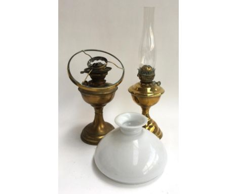 A brass oil lamp with chimney and glass shade, marked Eltex, together with one other marked Hinks No.2 Lever 