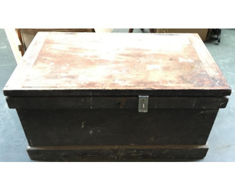 A wooden tool chest with sliding trays, containing a quantity of hand tools 