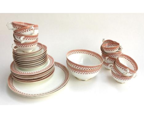 A Worcester porcelain part tea set in terracotta colours, comprising saucers (12), teacups (10), coffee cups (2) and saucers 