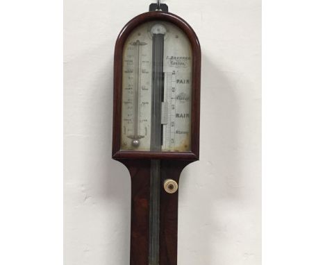 A mercury stick barometer by I Brunner, London, with arched top and carved ball base (af) 