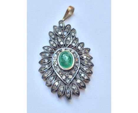 A Victorian emerald and diamond pendant, set with a cabochon emerald to the centre surrounded by 71 x Eight cut diamonds.  Go