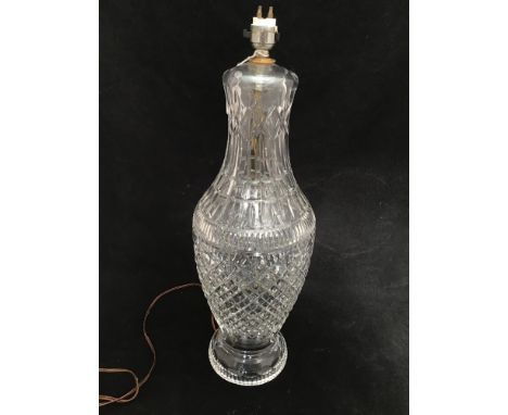 A large Waterford crystal lamp, of baluster form, geometric decoration, raised on fluted circular spreading glass foot, 45cm 