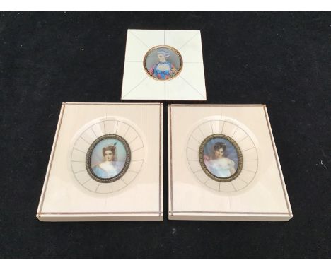 Two hand-painted miniature portraits of ladies, signed 'ST.MA', together with a miniature portrait print, framed (3) 