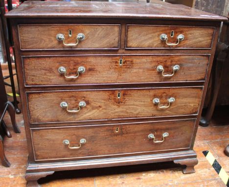 An early George III Cuban mahogany chest of two short and three long graduated drawers, with original brass handles, escutche