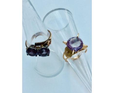 Two 14ct yellow gold Alexandrite rings.  The single stone ring weighs 4.6 grams, finger size L. The double stone ring weighs 