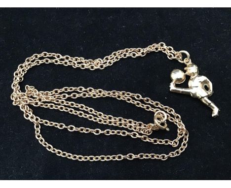 A 9ct gold chain with footballer pendant, approx. 12.9g, the chain approx. 71cm long, the pendant 3cm high 