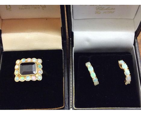 Pair of 18ct gold and opal half-hoop earrings and an 18ct gold garnet and opal ring, 7.23g gross 