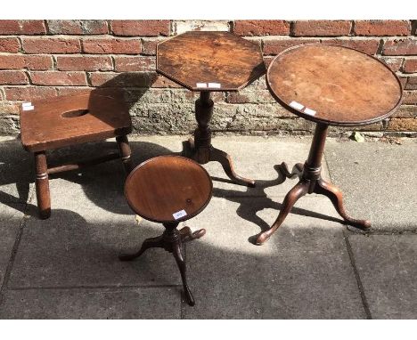 Two 19th century stained mahogany tripod tables and a reproduction tripod table, together with a stained wood four-legged sto