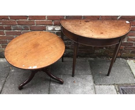 A George III demi-lune folding tea table with cross-banded top and square tapering supports, together with a cut-down mahogan