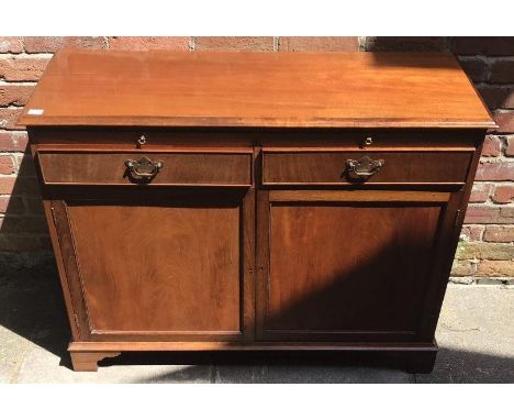 A reproduction mahogany drinks cupboard with slide out tray, raised on bracket feet (keys present), approx. 112cm wide, toget