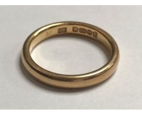 A 22ct gold wedding band, gross weight approximately 4.4g 
