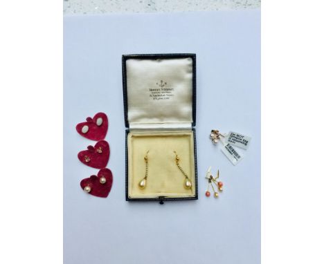 An assorted lot of 9ct gold earrings. Including a pair of drop seed pearl earrings and a pair of drop coral and freshwater pe