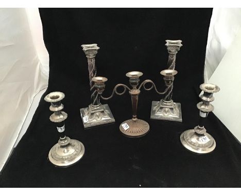 A good quality pair of silver-plated candlesticks by Elkington &amp; Co. modelled as classical columns, the square base with 