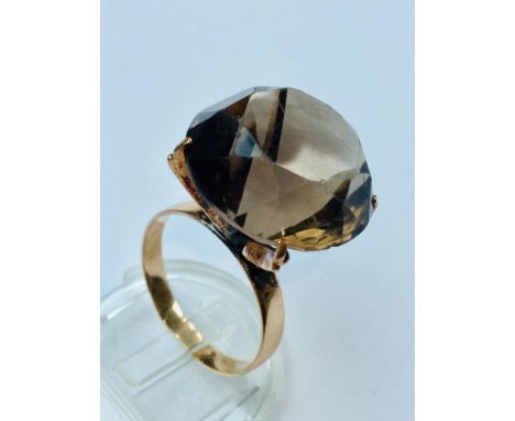 A 14ct yellow gold Smokey Quartz dress ring, weighing 8.5 grams, finger size Q.  Together with a 14ct yellow gold blue stone 