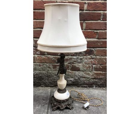 A brass and marble table lamp, the support decorated with a putti, raised on scrolled, squared base, 78cm tall 
