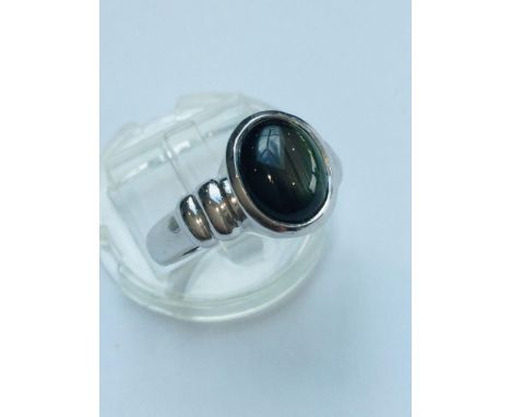 A 9ct white gold ring, set with an oval black star sapphire. Ring weighs 5.9 grams, finger size N.  Together with a pair of 9