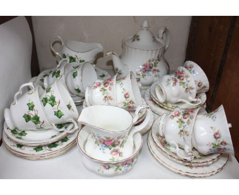 SECTION 23.  A Royal Albert 'Moss Rose' pattern tea set comprising six each cups, saucers and sandwich plates, teapot, milk &