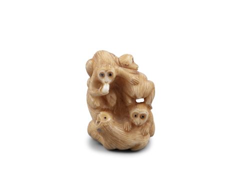 *TOMOKAZU友一: AN IVORY 'SEVEN COILED MONKEYS' KATABORI NETSUKE Japan, Kyoto, Edo period Pierced with two himotoshi. With signa