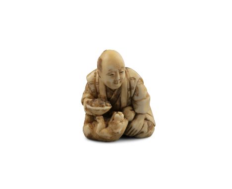 *TOMOYUKI友之 - AN IVORY 'MAN AND PUPPY' KATABORI NETSUKE Japan, Meiji period Pierced with two himotochi. With a signature read