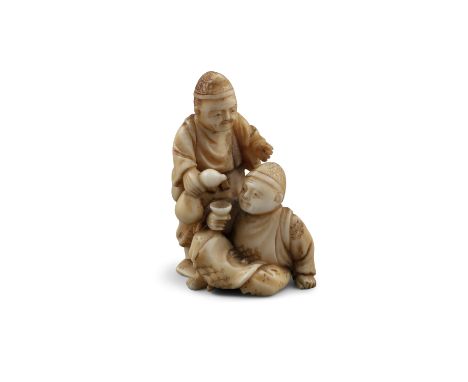 *ICHIGYOKU一玉: AN IVORY 'TWO MEN DRINKING WINE' KATABORI NETSUKE Japan, Meiji period Pierced with two himotoshi. With signatur