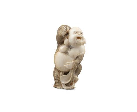 *TOMOKAZU友一: AN IVORY 'MAN TAMING A DEMON' KATABORI NETSUKE Japan, Meiji to Taisho period Pierced with two himotoshi. With a 