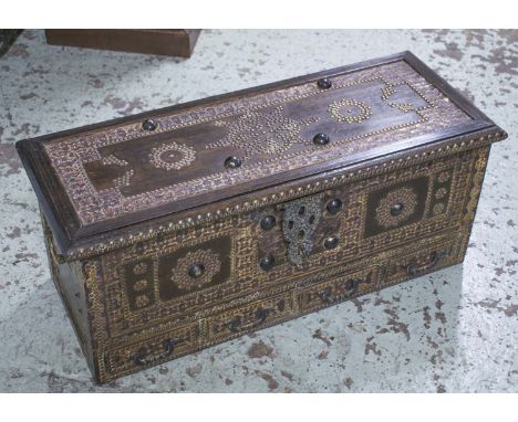 ZANZIBAR TRUNK, vintage Moorish hardwood and brass mounted, with rising lid and four short drawers, 85cm W x 35cm H x 33cm D.